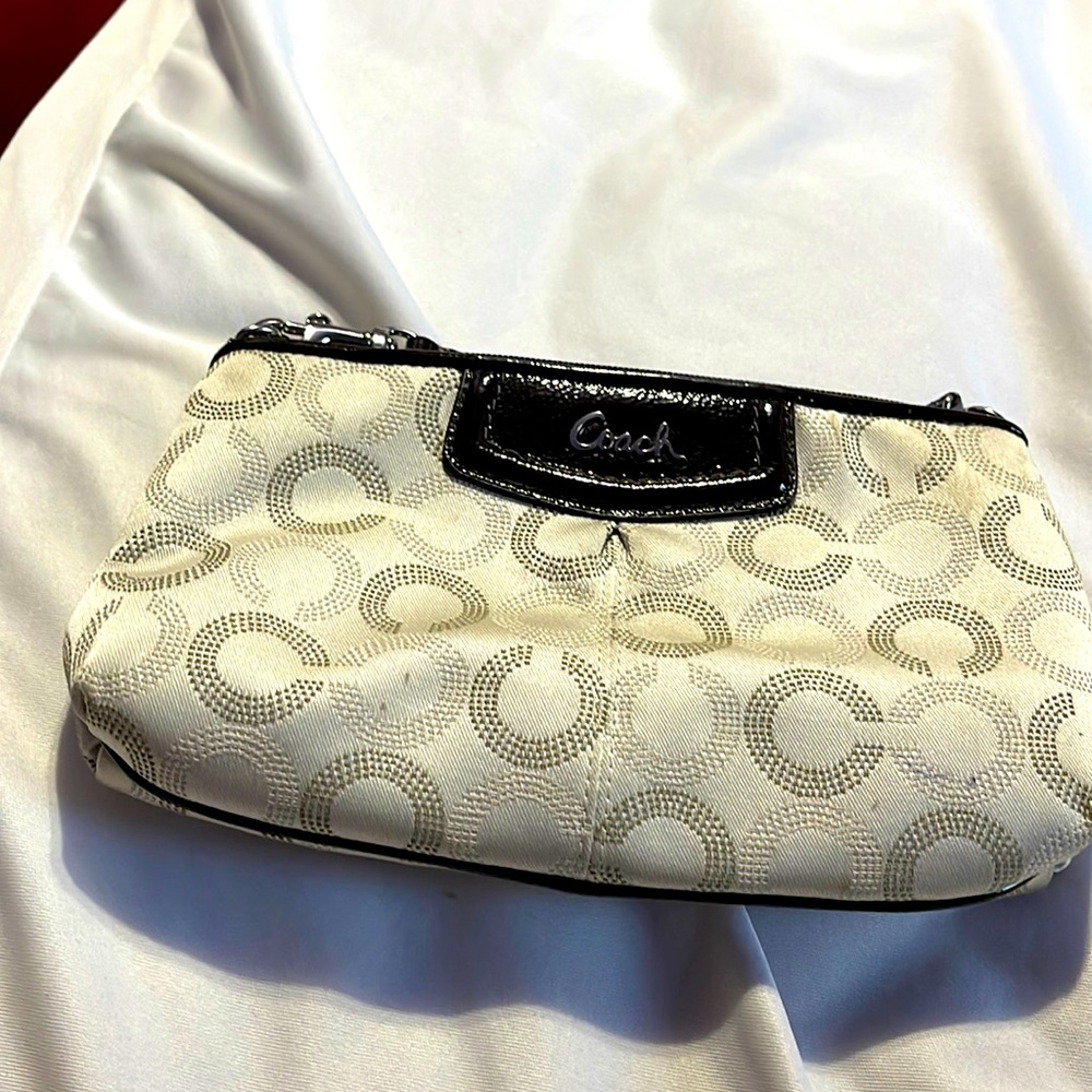 Monogrammed Coach wristlet with a few imperfections on the fabric